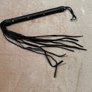 Black Leather Whip with Gold Stud Accents